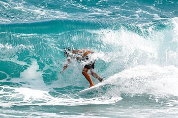 Surfer riding wave