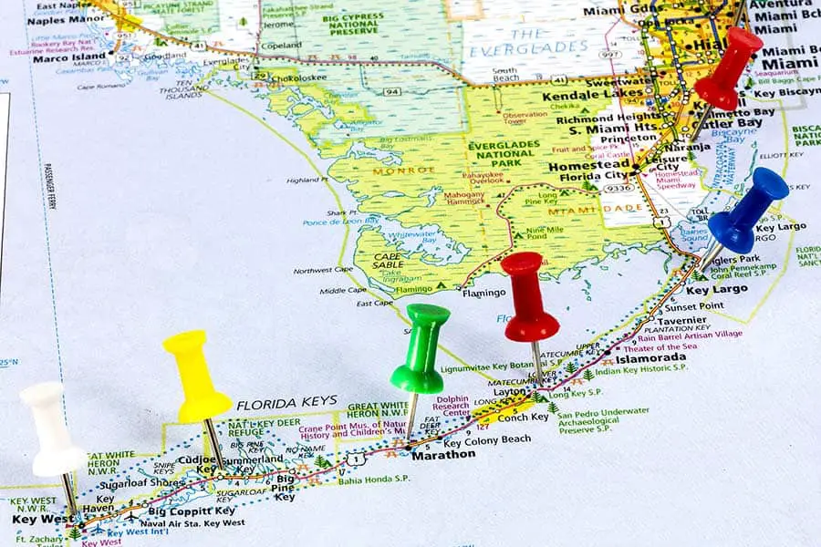 Multi colored push pins on Florida Keys map