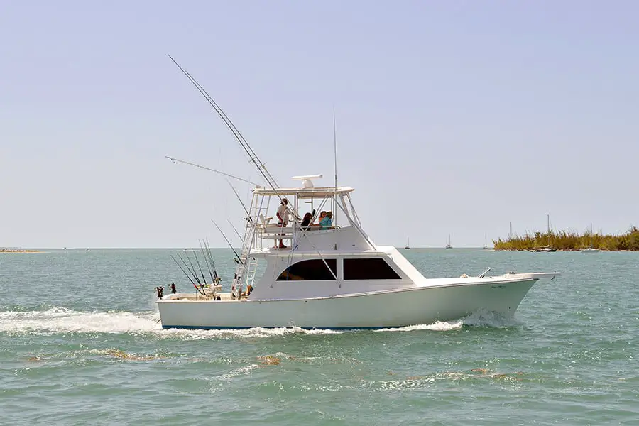 White fishing boat heads back to shore