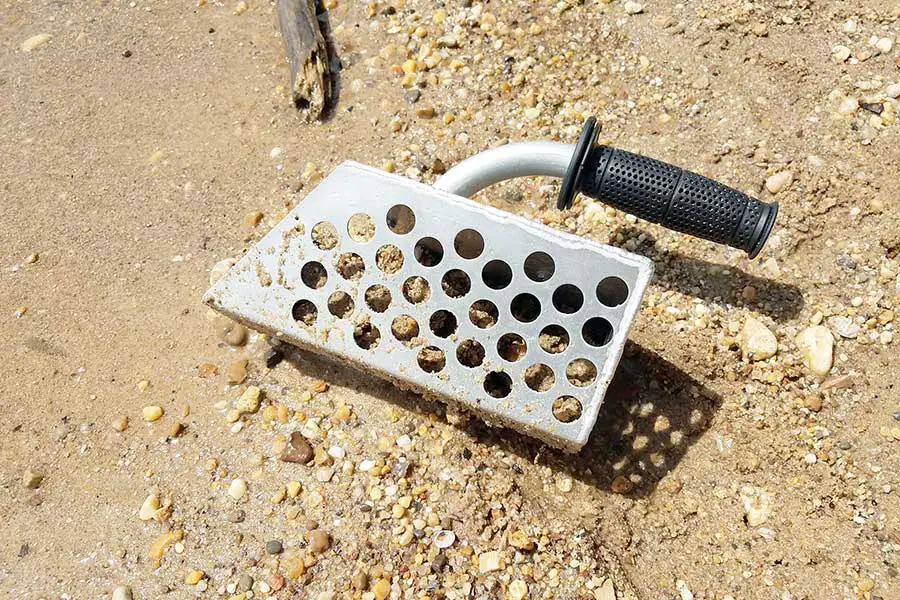 Metal sieve used for sifting beach sand