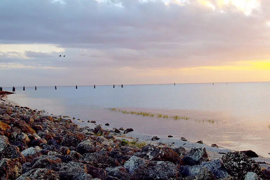 Rocky shoreline and calm water at lake