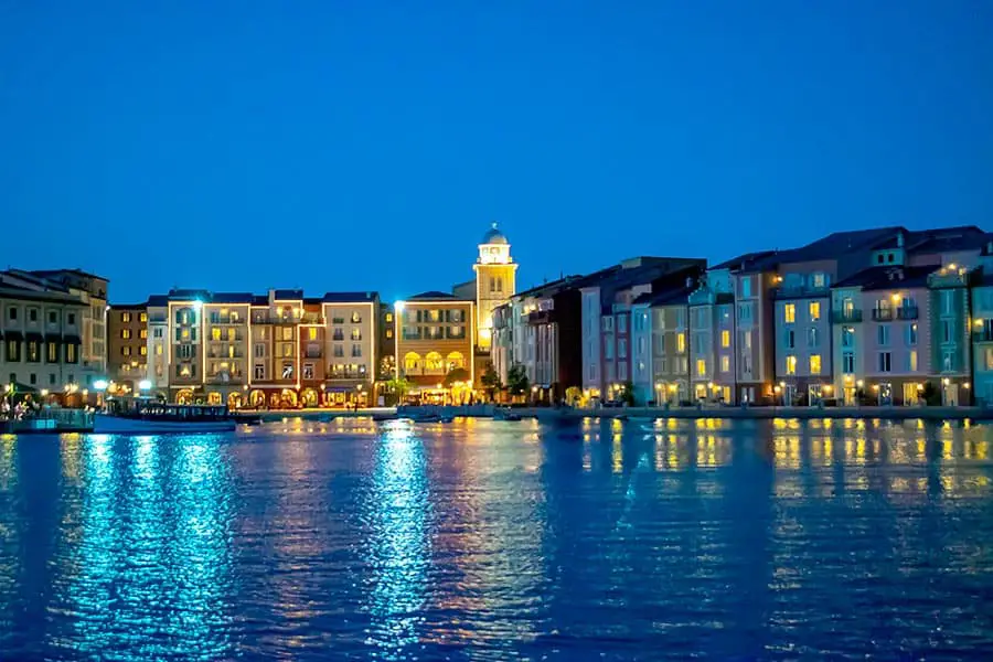 Water front hotel's lights reflecting off water at night