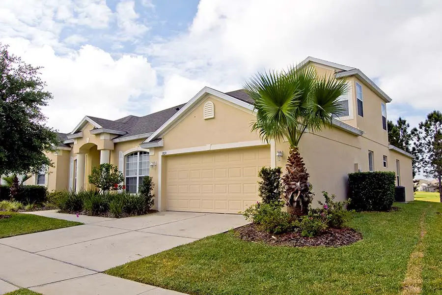 Typical neighborhood house with manicured lawn in Florida