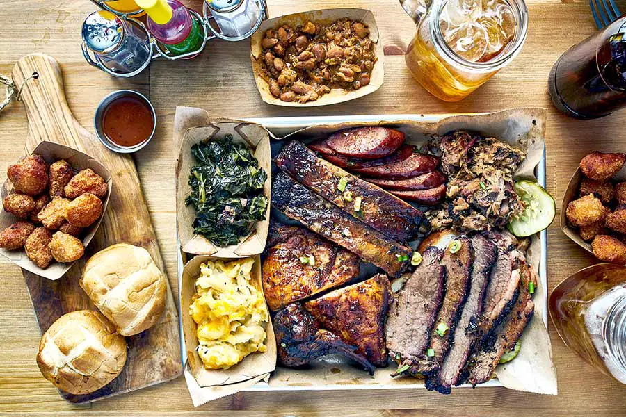 Table full of Texas style BBQ food
