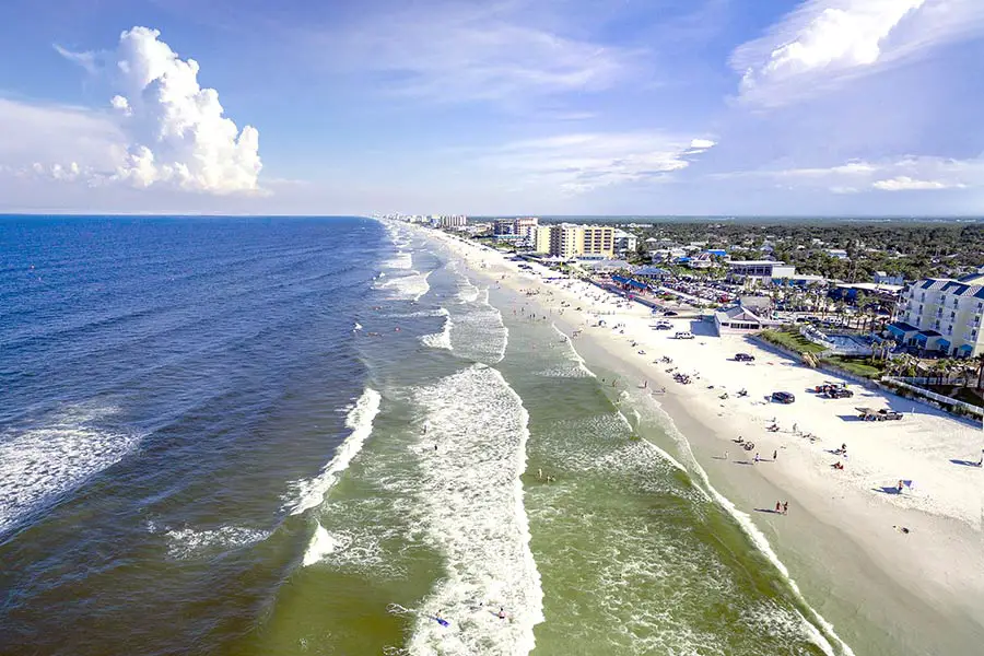 Birdseye view of people and buildings on New Smyrna Beach, Florida