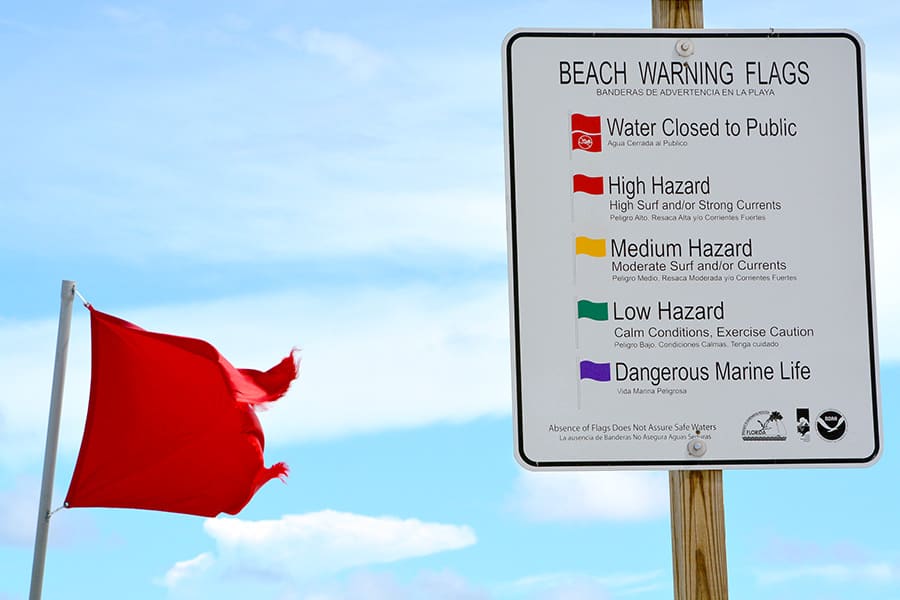 Red warning flag, hazard high surf and strong currents