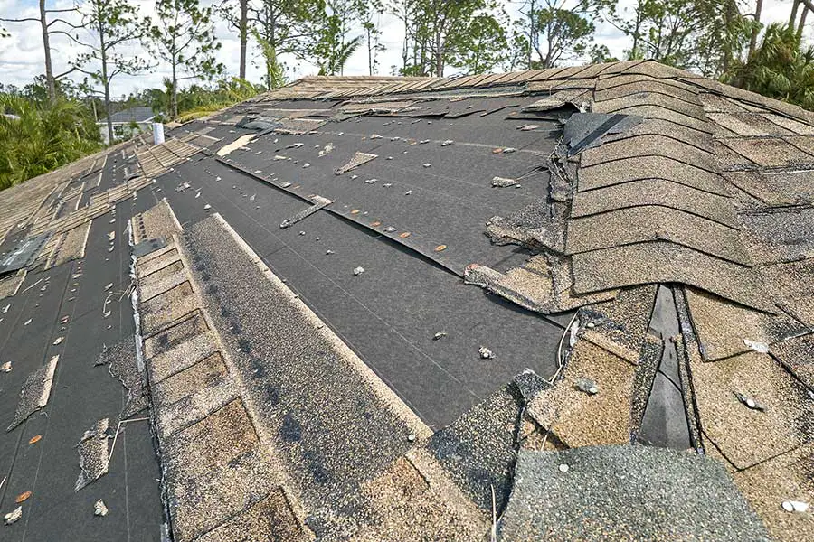 Shingles ripped off house roof during hurricane